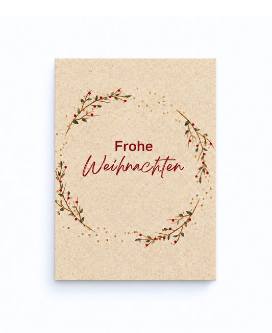 Weihnachtskarte aus Graspapier mit Schriftzug Fröhliche Weihnachten und Aquarell-Motiv